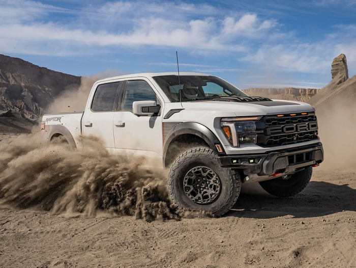 White Ford F-150 turning in the dirt