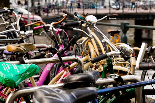 A Group of bicycles parked on a sidewalk