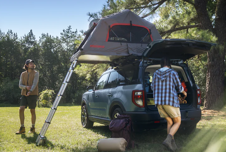 People Camping in 2025 Ford Bronco Sport with tent accessories